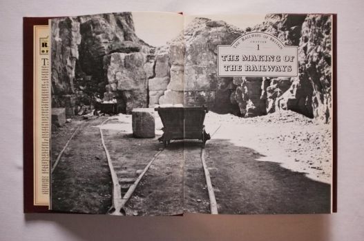 In this double-page black-and-white photograph on pages 8-9 of The Railways of Britain, taken in 1911, miners load a wagon at Lockhampton Hill Quarry near Cheltenham.