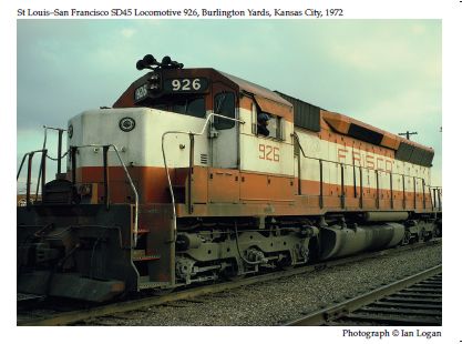 In the Burlington Yards, Kansas City, in 1972, the engineer of this St Louis-San Francisco SD45 locomotive detached his train and rolled forward so the railfan designer Ian Logan could take this colour photograph of the locomotive with the number 926 and the nickname Frisco picked out in orangey brown on a thick white band. 