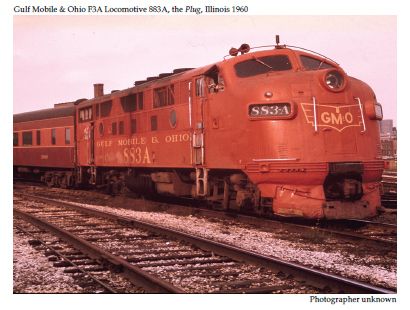 In a colour photograph from 1960, the F3A locomotive 883A painted Gulf Mobile & Ohio brown leads the commuter train between Chicago and Joliet that was widely known as The Plug.