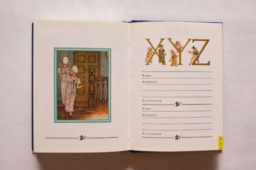 Among illustrations of two girls going up to bed are spaces to write down contact details of two people, under an image header of the letters X, Y and Z.