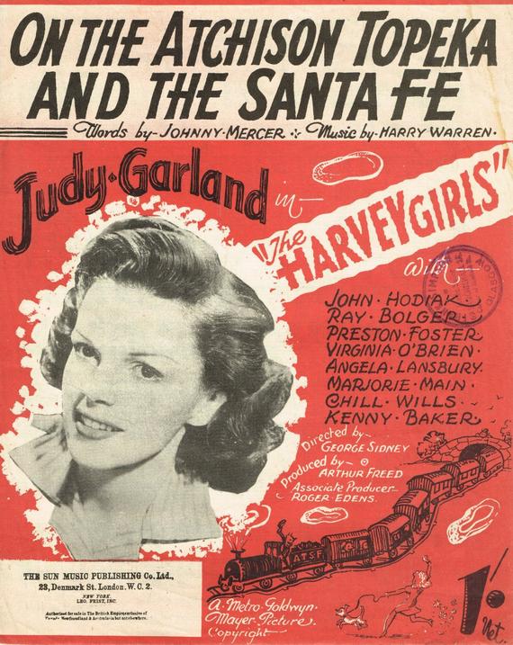 On this 1945 sheet music cover of ‘On the Atchison Topeka & Sant Fe’ is a head shot of Judy Garland and a drawing of an American-style locomotive hauling an AT&SF passenger train.