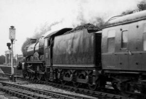Black and white photograph of steam locomotive at Henley station, hauling the evening express from London, 13th June 1963.