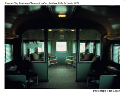 In this colour photograph taken in St Louis in 1972 by the railfan designer Ian Logan, the interior of an observation car built by Pullman for the Kansas City Southern Railway’s Southern Belle is warmed by subdued lighting, furnished with chromed-steel and leather armchairs, hung with curtains and Venetian blinds and embellished with engraved glass panels.