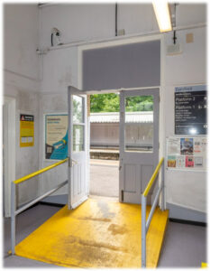 The platform doors at Eynsford have their fanlight boarded up and are painted an institutional grey.  
