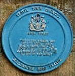 Colour photograph of a blue plaque marking the location of Thomas Hardy’s home, a memorable part of Yeovil's literary scene. 