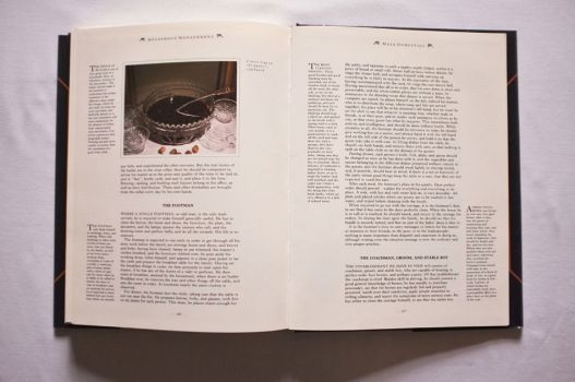 On these two pages from Chapter 16 of The Shorter Mrs. Beeton, on Household Management, advice is given on handling Male Domestics, including The Footman, The Coachman, Groom and Stable Boy, accompanied by a colour photograph of Claret Cup on the butler’s sideboard. 