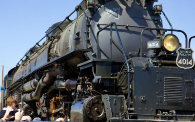 In this color photograph of Big Boy 4014 taken by Ian Logan in October 2019, crowds cluster around Big Boy 4014 in the Union Pacific West Colton Yard, Los Angeles.