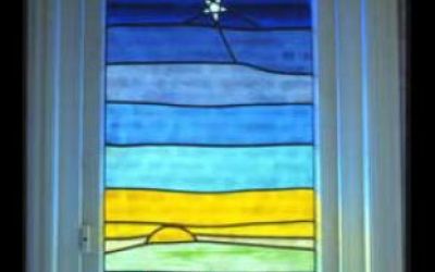 Stained-glass frog and stars.