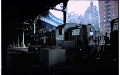 Colour photograph taken by Ian Logan in the 1970s of a Penn Central diesel locomotive in the West 60th Street yard in Manhattan.