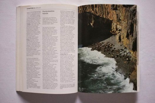 An excerpt from Wild Britain describes the Pembrokeshire Islands. A photograph of sunbathing seals occupies the right page.