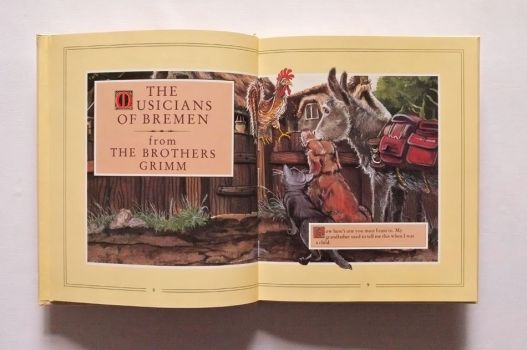 The opening page of The Musicians of Bremen depicts the cat, dog and donkey recruiting the cock.