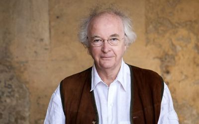 Photograph of Sir Philip Pullman wearing a nut-brown waistcoat.